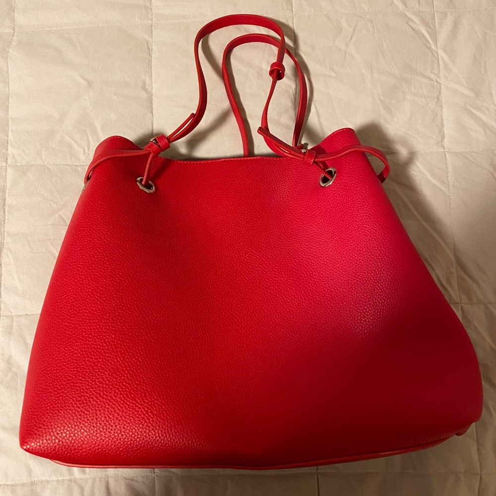 Red pebbled faux leather bag